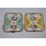 A near-pair of Dresden porcelain dishes, each decorated with panels of figures and floral sprays,