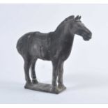 A Chinese hollow moulded black terracotta horse, modelled in standing pose with incised face and