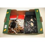 A box of costume jewellery, to include beaded necklaces, silver napkin ring, brooches etc