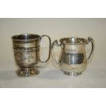 A George III silver twin handled cup, Edinburgh 1812, h.6.5cm, 3.9oz; together with a silver