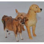 A Beswick model of a labrador, No.1548, golden yellow matt, h.14.5cm; together with a Beswick