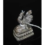 A sterling silver and green hardstone set desk ornament in the form of a seal, h.49mm, the whole