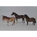 A Beswick model of a donkey, No.1364B, natural gloss, h.11cm; together with a Beswick model of a