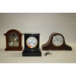 A Victorian black slate eight-day mantel clock, the enamelled dial showing Roman numerals, h.22.5cm;