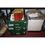 Six boxes of mixed toys and games including miniature dartboard, Scalextric accessories etc