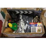 A box of miscellaneous items to include books, playing cards, ornaments etc