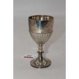 A George V silver cup, of half-gadrooned form, inscribed 'Abraham Cup 1930-1931 H Denis Firth',