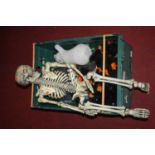 Two boxes of various Hallowe'en figures including skeletons etc