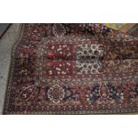 A Persian style European manufactured machine-woven floral decorated carpet