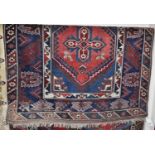 A Persian woollen blue ground Tabriz rug, 200 x 125cm