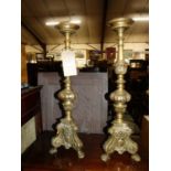 A pair of Continental brass table pricket sticks, height 64cm