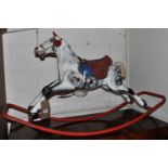 A mid-20th century Triang painted pressed metal child's rocking horse, length 110cm