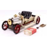 A Mamod No. SA1 steam roadster, comprising of a white body with red chassis and spoked hubs, with