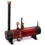 A scratchbuilt stationary steam engine boiler comprising of wooden clad and brassbound body,