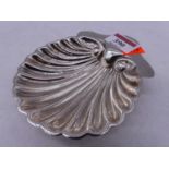 An early 20th century silver scallop shaped dish, marks rubbed, width 13cm, 2.4oz