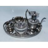 A silver plated four piece tea and coffee service, of half reeded form with engraved floral