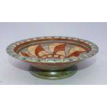 A Burleighware pottery bowl by Charlotte Rhead of stepped circular form decorated in the