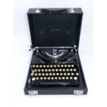 An Imperial 'The Good Companion' portable typewriter in fitted case, numbered G328; together with an