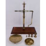 A set of early 20th century Avery beam scales, patent No.77688, with brass pan and weights, all on a