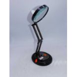 A reproduction adjustable table-top magnifier