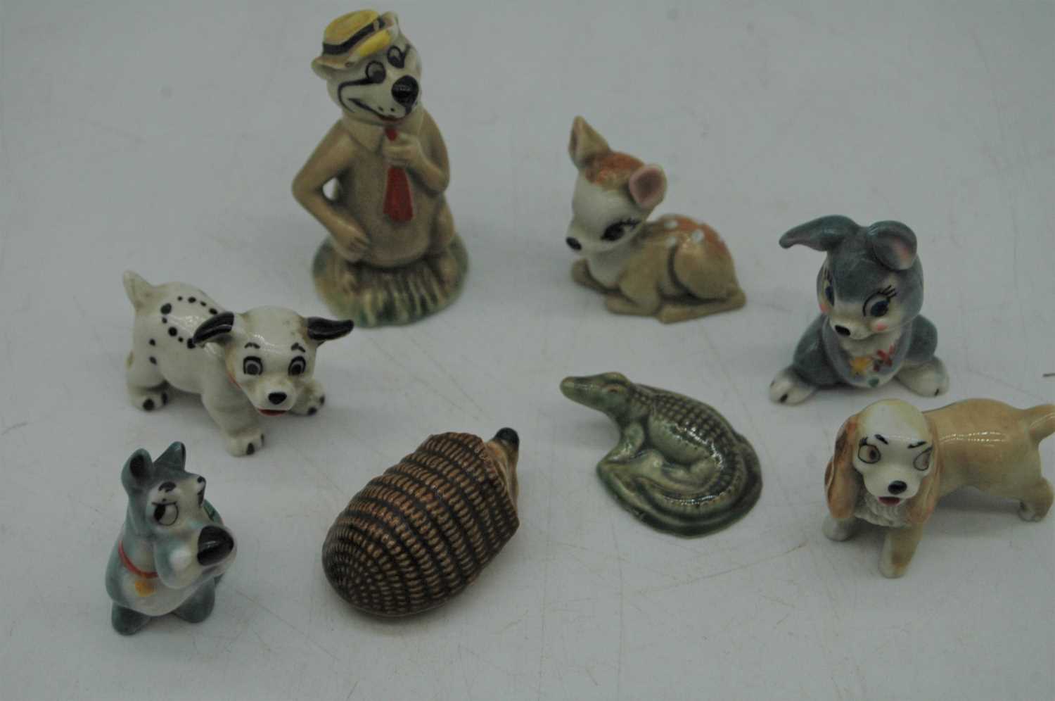 A collection of Wade and other miniature pottery animal figures