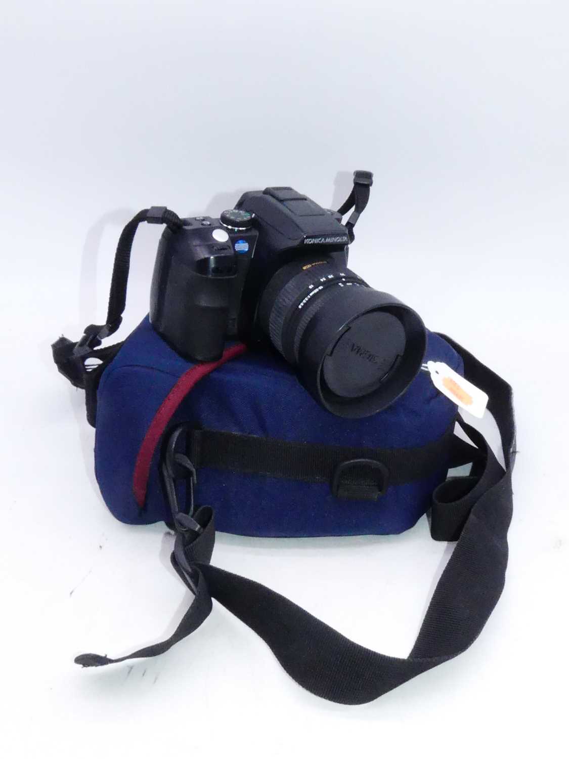 A Konica Minolta Dynax 5D digital SLR camera, with travel case
