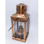 A copper hanging lantern, having interior spirit burner, h.40cm