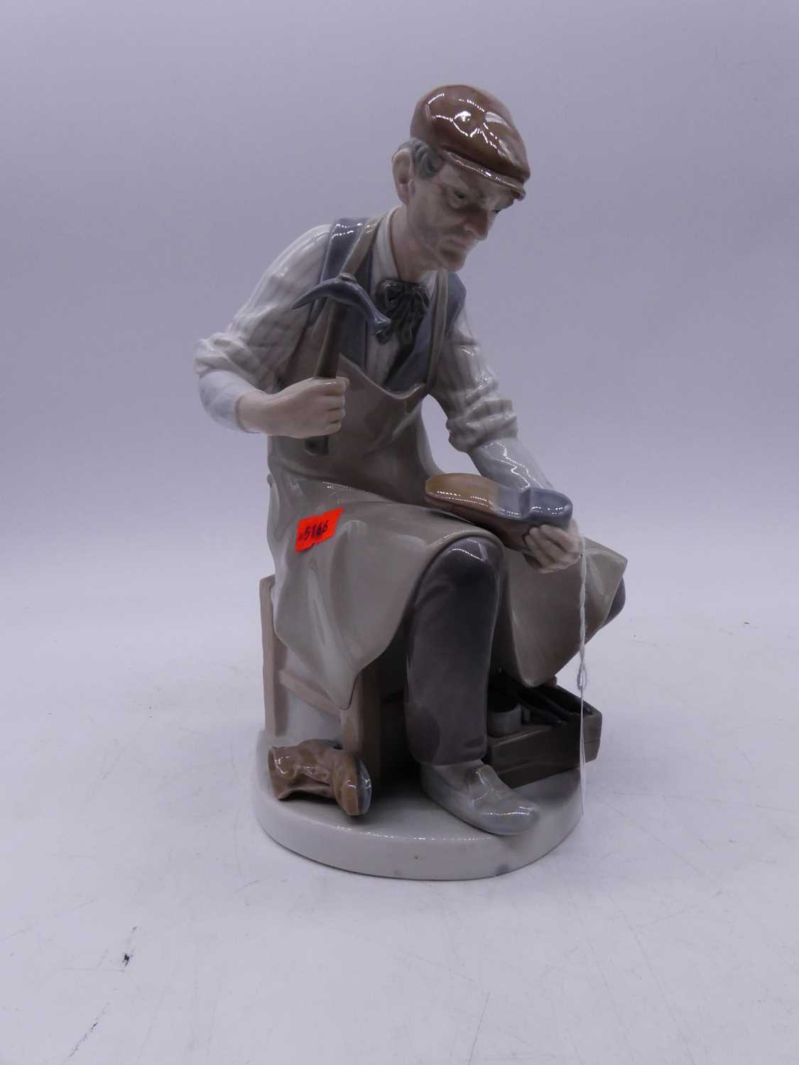 A large Lladro Spanish porcelain figure of a cobbler, having printed mark verso, h.25cm; together - Image 2 of 6