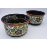 A pair of Dutch Gouda pottery bowls, decorated in the Persia pattern, having hand-painted marks