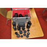 A collection of various photography equipment to include a Pentacon 4/300 GDR camera lens,