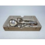 A collection of silver and silver plated flatware, to include teaspoons, sugar nips and a sauce