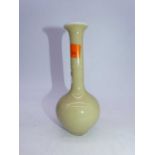 A Chinese export stem vase, on a pale yellow ground, having slender neck and bulbous lower body, h.