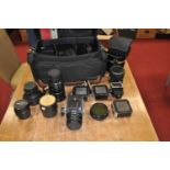 A collection of photography equipment, to include a CCCP Onntep 3.5/250 lens, another CCCP lens, and