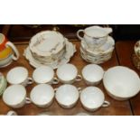 A Royal Crown Derby Bone China part eight-place setting tea service, in the Devonshire pattern,