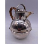 A George VI silver Guernsey style jug, Birmingham 1946, having wicker handle, height 16cm, the gross