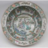 A large 19th century Chinese export bowl in the Famille Rose pallet, the centre enamel decorated