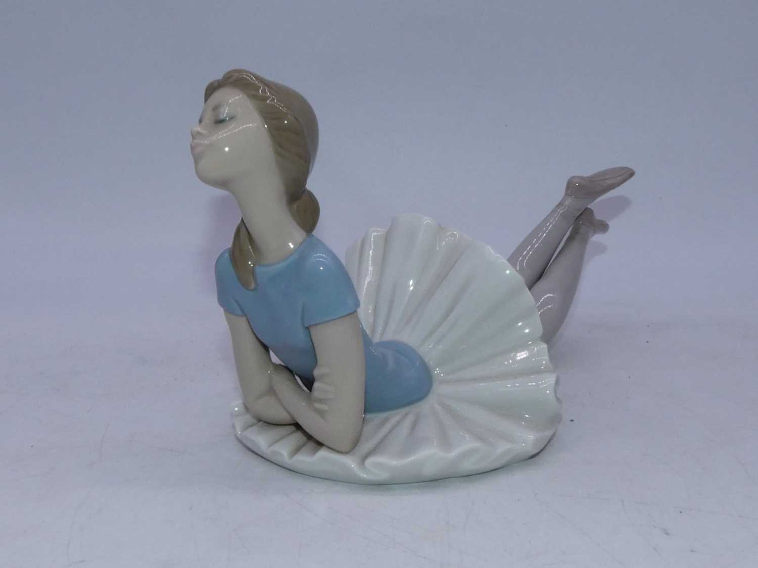 A Lladro Spanish porcelain figure of a ballerina, in reclining pose, having printed mark verso; - Image 3 of 4