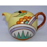 In the manner of Clarice Cliff - an Art Deco teapot of globular form, hand-painted in bright orange,
