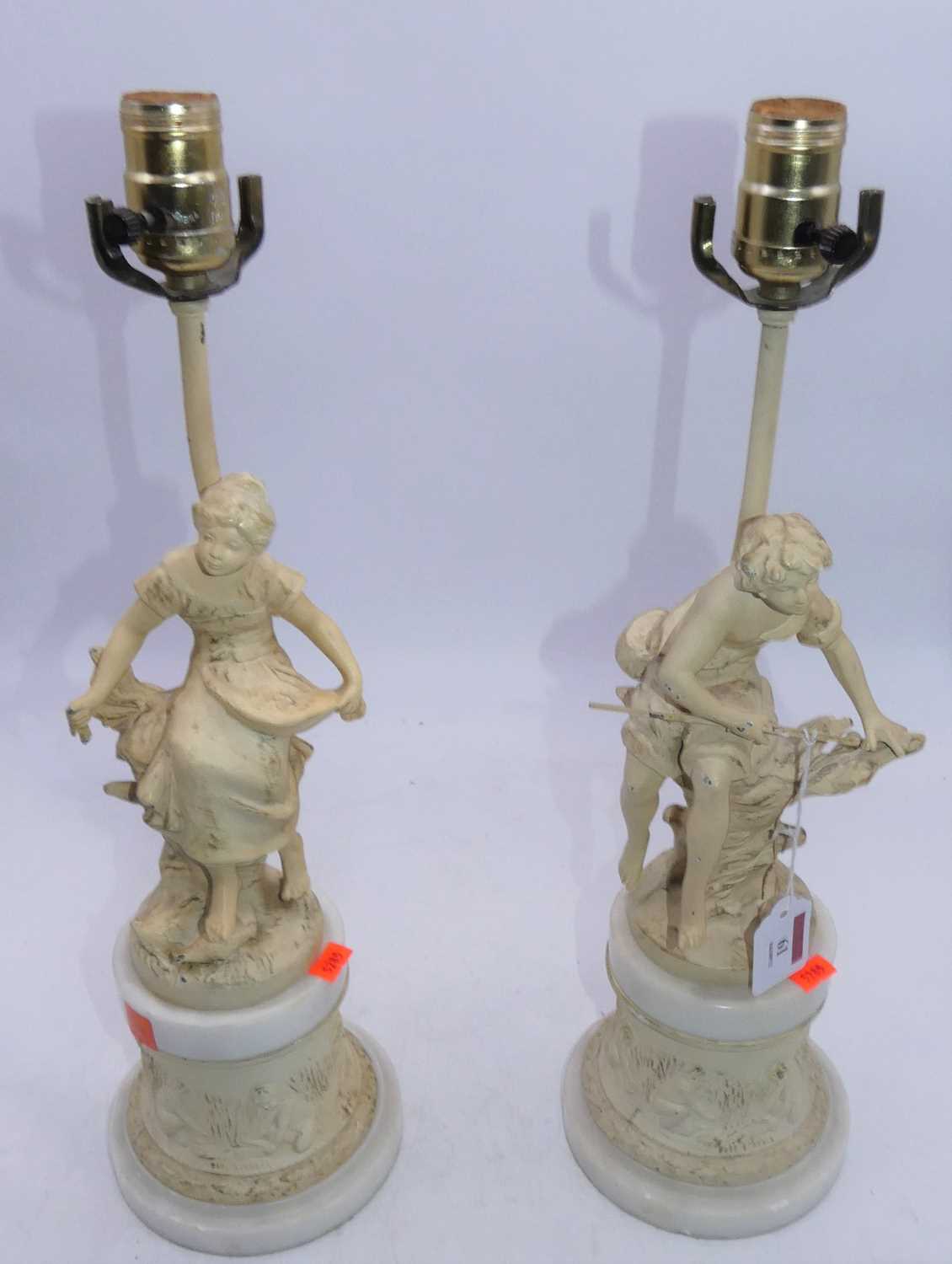 A pair of spelter and later cream painted figural table lamps, h.48cm (including fittings)