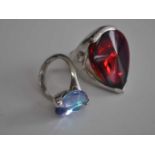 A ladies Baccarat silver dress ring, set with a large pear shaped red crystal, stamped Baccarat T53,