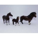 A Royal Doulton figure of a Shetland pony, brown gloss finish; together with two other Royal Doulton