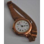 A vintage ladies 9ct gold cased wrist watch having manual wind movement, unsigned white enamel