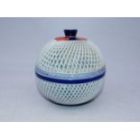 A reproduction Japanese style jar and cover, having overlaid reticulated globular body within blue