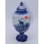 A Royal Bon Delft pottery vase and cover of oval form to an octagonal base, typically decorated with