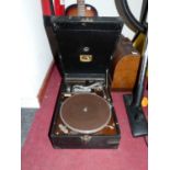 A vintage Taylor & Son portable gramophone; together with a collection of records