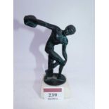 A small bronzed metal figure of a male discus thrower, on marble plinth, h.13cm