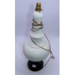 A 20th century white glazed ceramic table lamp of bulbous tapering form, height 54cm (a/f)