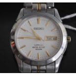 A Seiko sapphire gents steel case quartz wrist watch having signed day date dial and on integral