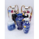A pair of early 20th century Vienna style porcelain vases, each of amphora shape, the central