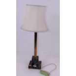 A French style table lamp, having a brass fluted column on a stepped veined marble base, with